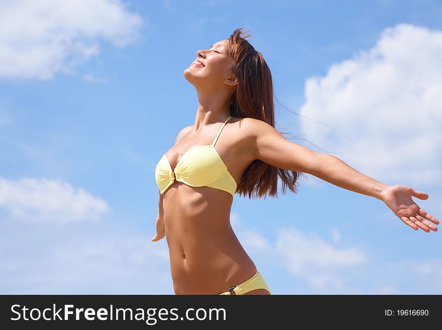 Portrait of young attractive woman having good time in the beach. Portrait of young attractive woman having good time in the beach
