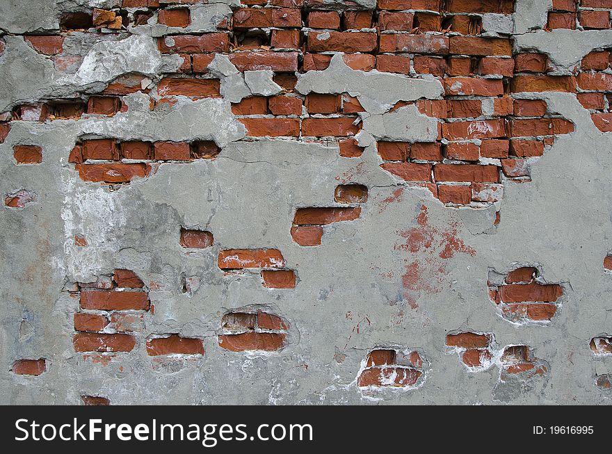 Red brick wall partially plastered. Red brick wall partially plastered