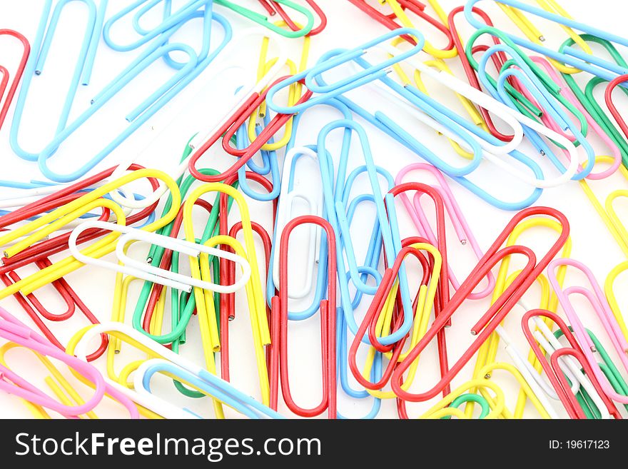 Closeup Of Multi-colored Paper Clips Background