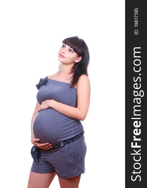 Pregnant woman in casual clothes isolated on white background. Pregnant woman in casual clothes isolated on white background