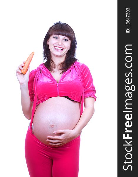 Pregnant woman with carrot isolated over white background