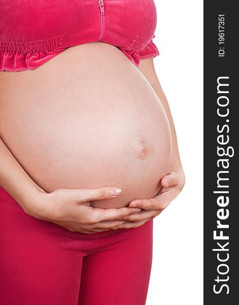 Image of pregnant woman touching her belly with hands isolated over white background