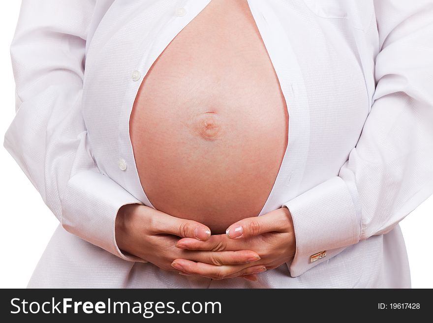 Close-up of pregnant woman touching her belly isolated over white background
