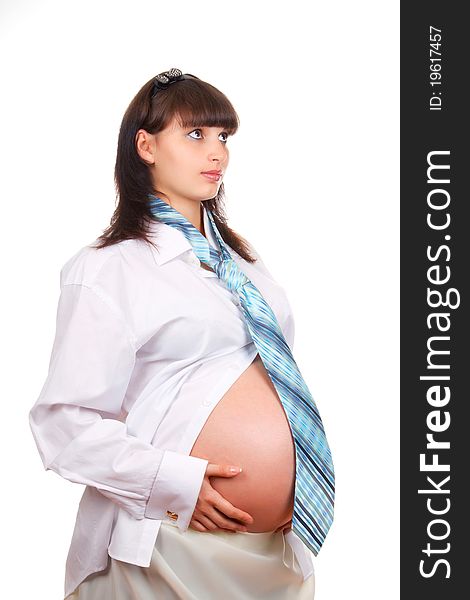 Pregnant businesswoman wearing a man's shirt and tie isolated over white background. Pregnant businesswoman wearing a man's shirt and tie isolated over white background