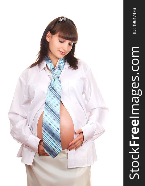 Pregnant businesswoman wearing a man's shirt and tie isolated over white background. Pregnant businesswoman wearing a man's shirt and tie isolated over white background