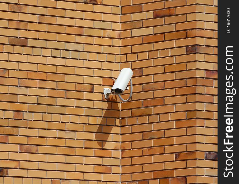 Security camera ower the brick wall