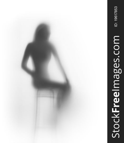 Beautiful woman silhouette behind a curtain. Beautiful woman silhouette behind a curtain