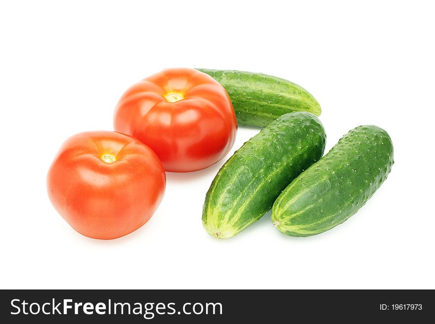 Cucumbers and tomatoes on white background