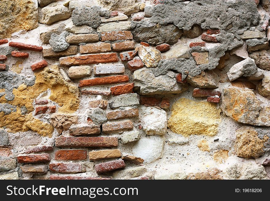 Old broken brick wall background. Old broken brick wall background.