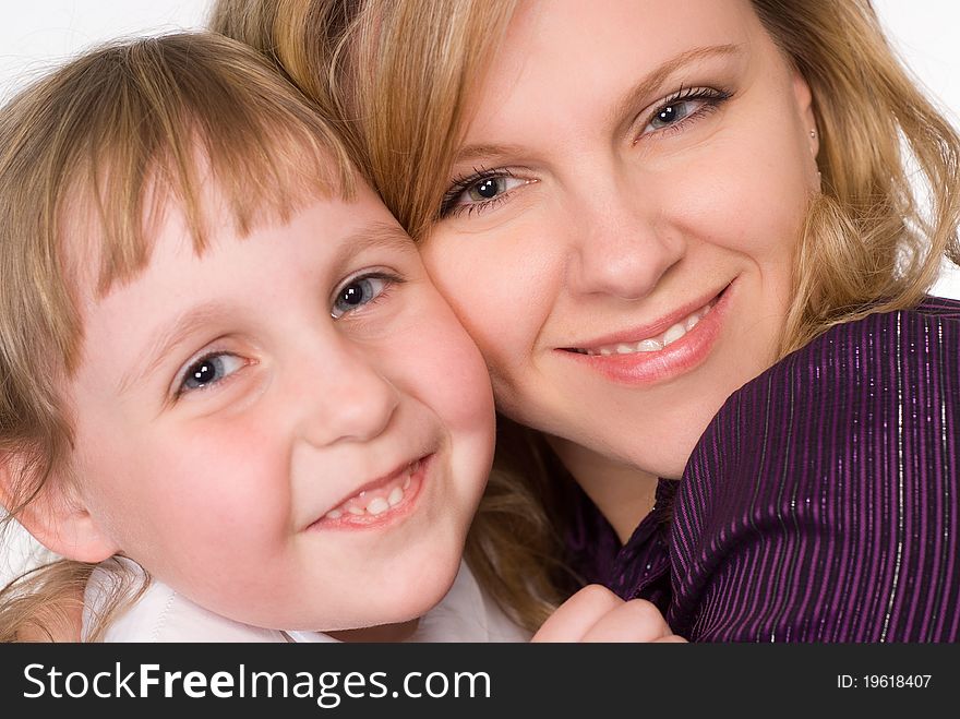 Happy mom with her daughter on a white background. Happy mom with her daughter on a white background