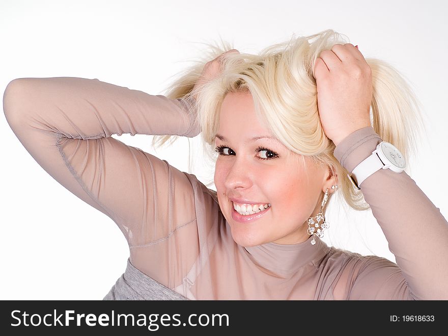 Wonderful girl in a grey clothes on a white background. Wonderful girl in a grey clothes on a white background