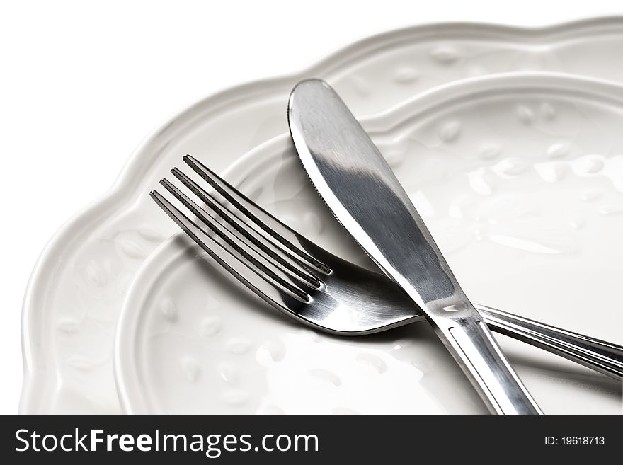 Dinner plates with knife and fork