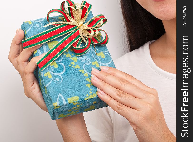 Female hand holding gift box. Female hand holding gift box
