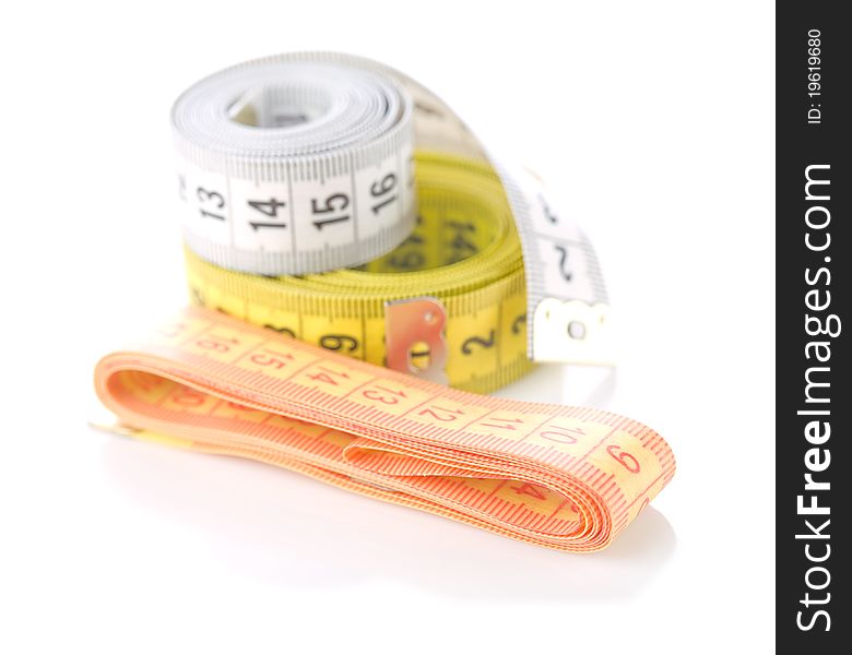 Studio shot of sewing composition
of measuring tapes isolated