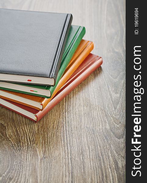 Studio shot
stack of colored of notebooks
wooden boards. Studio shot
stack of colored of notebooks
wooden boards