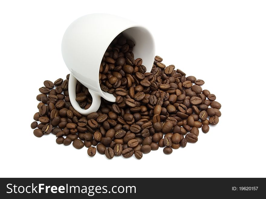 Coffee grains falling from light cup on white background. Coffee grains falling from light cup on white background