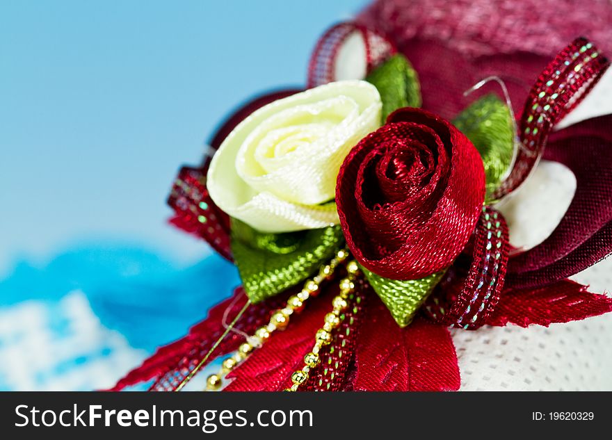 Close up of the ribbon rose on the door gift with blue background. Close up of the ribbon rose on the door gift with blue background