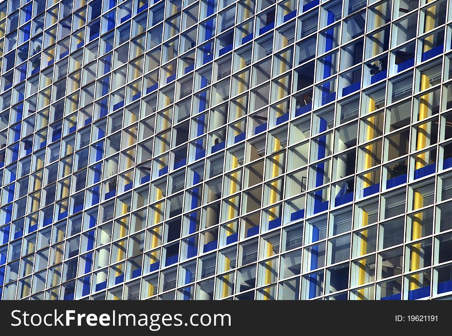 Colorful blue and yellow square windows of office building exterior. Colorful blue and yellow square windows of office building exterior