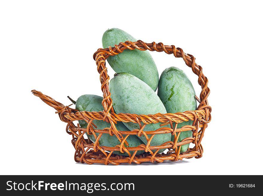 Mangoes in the basket on white