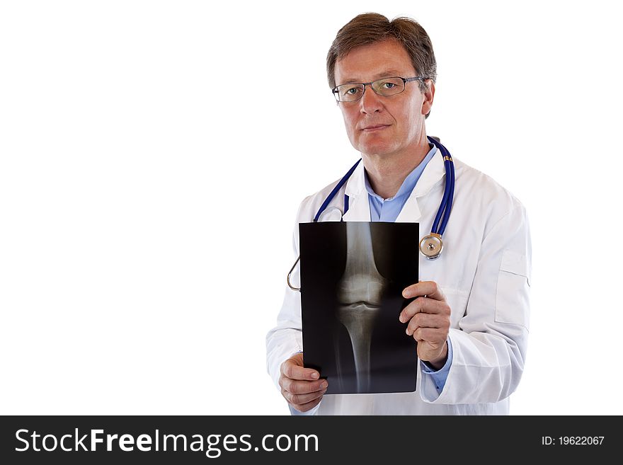 Friendly elderly doctor holds radiograph.Isolated on white background.
