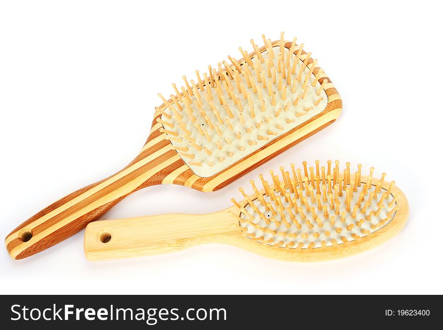 Wooden combs isolated on white background.