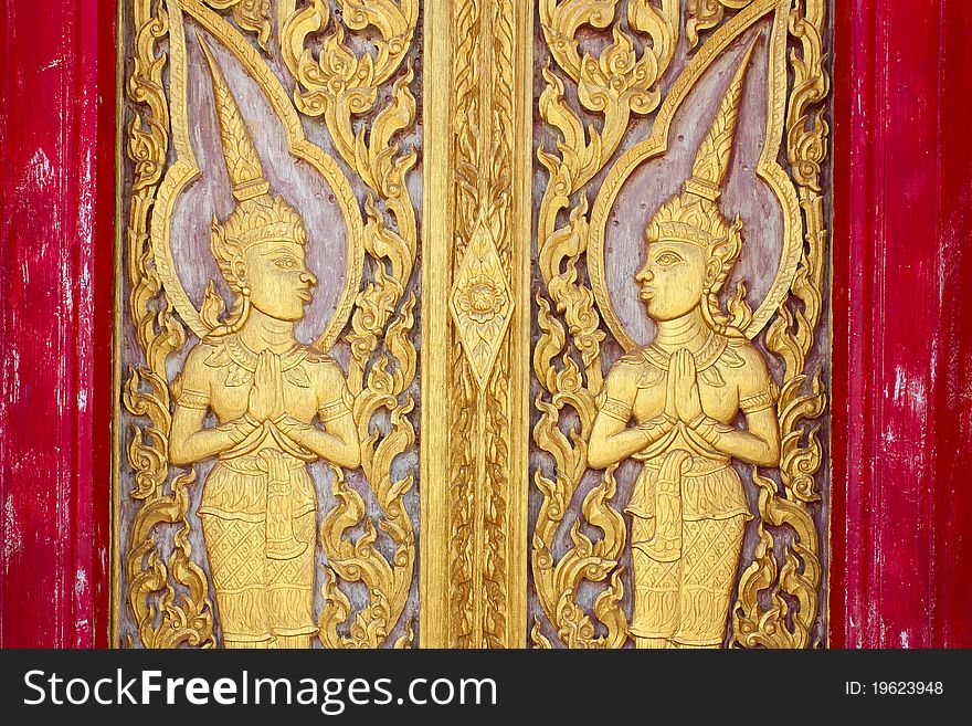 Thai temple doors carved with delicate beauty climaxed in Thai temples. Thai temple doors carved with delicate beauty climaxed in Thai temples.