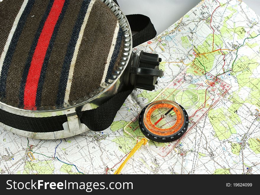Bottle, magnetic compass and map. Bottle, magnetic compass and map