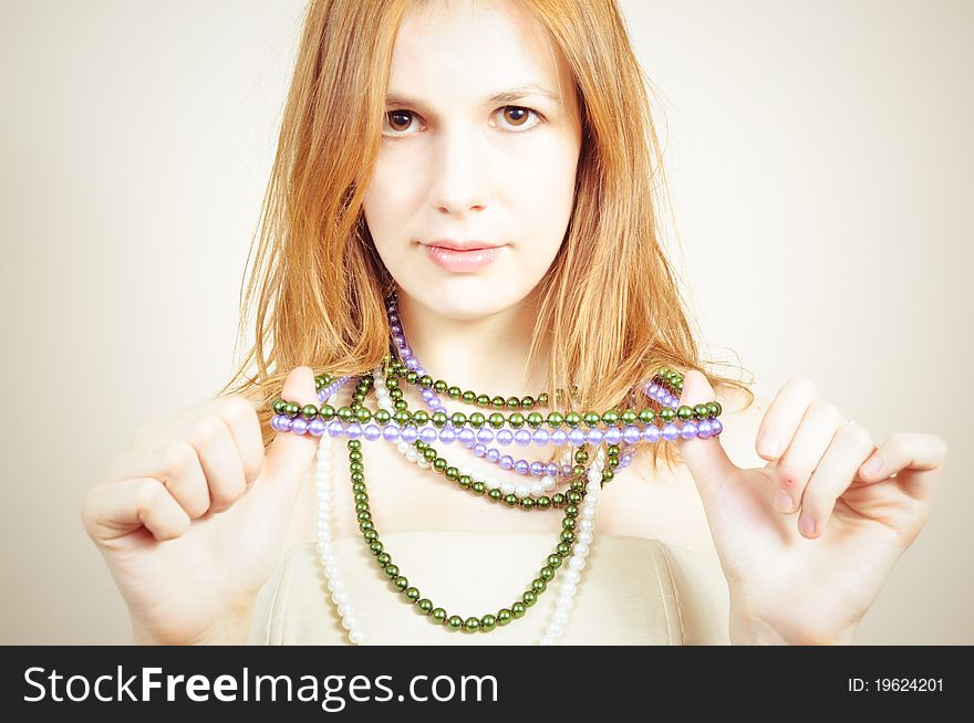 Portrait of an attractive beautiful blond woman with a necklace. Portrait of an attractive beautiful blond woman with a necklace
