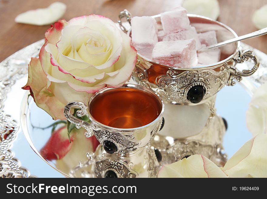 East sweets on silver ware with rose