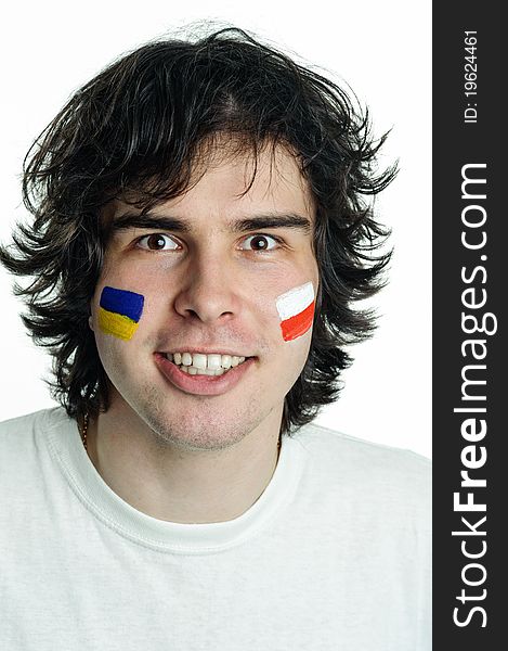 An image of football fan with flags on face. An image of football fan with flags on face