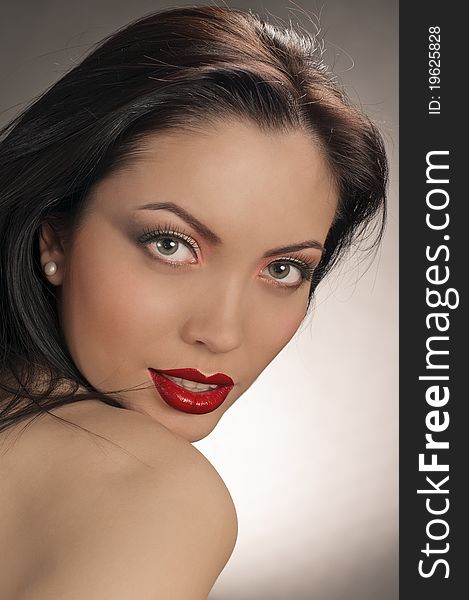 Portrait of beautiful brunette girl with beautiful red lips. Portrait of beautiful brunette girl with beautiful red lips