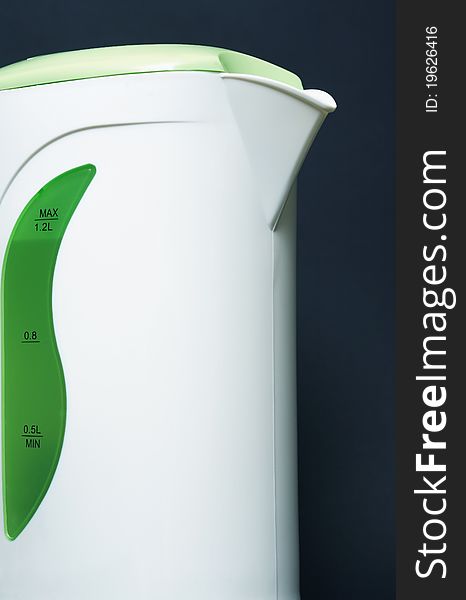 Extreme closeup of modern electric kettle on dark background. Extreme closeup of modern electric kettle on dark background