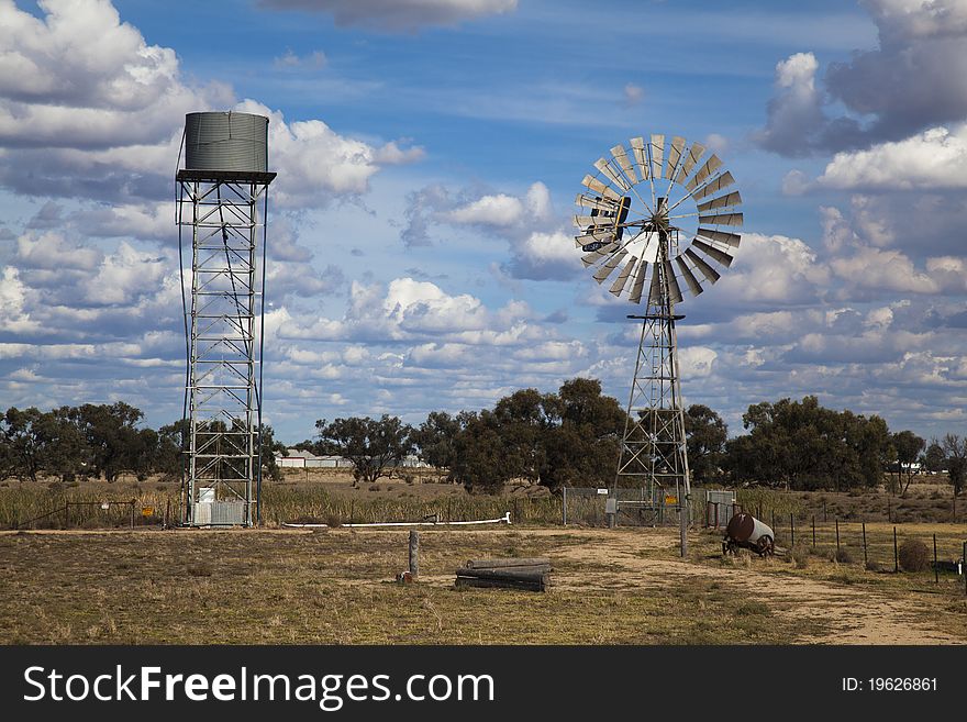 A typical scene in the Outback of a windmill and elevated water tank. A typical scene in the Outback of a windmill and elevated water tank