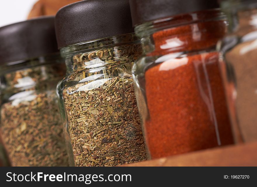 Set of spices in glass bottles