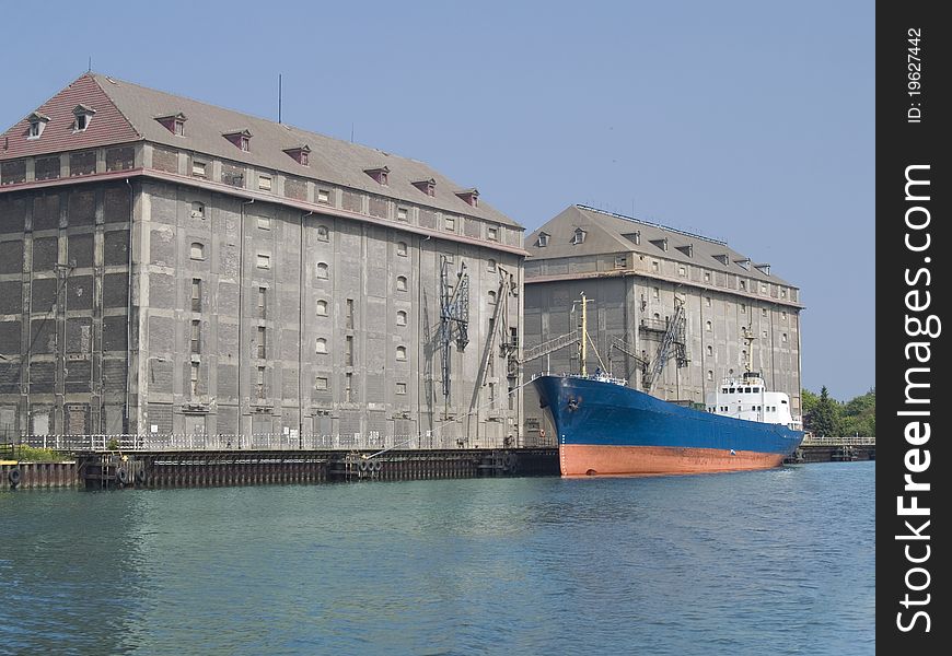 Elevators for malt and grain located beside port canal;