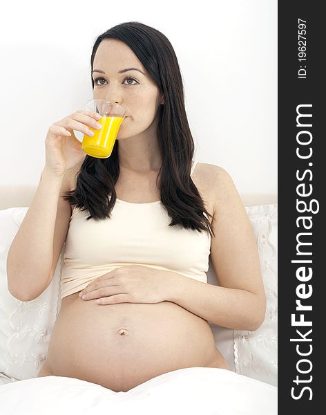 Pregnant Woman Drinking Orange Juice