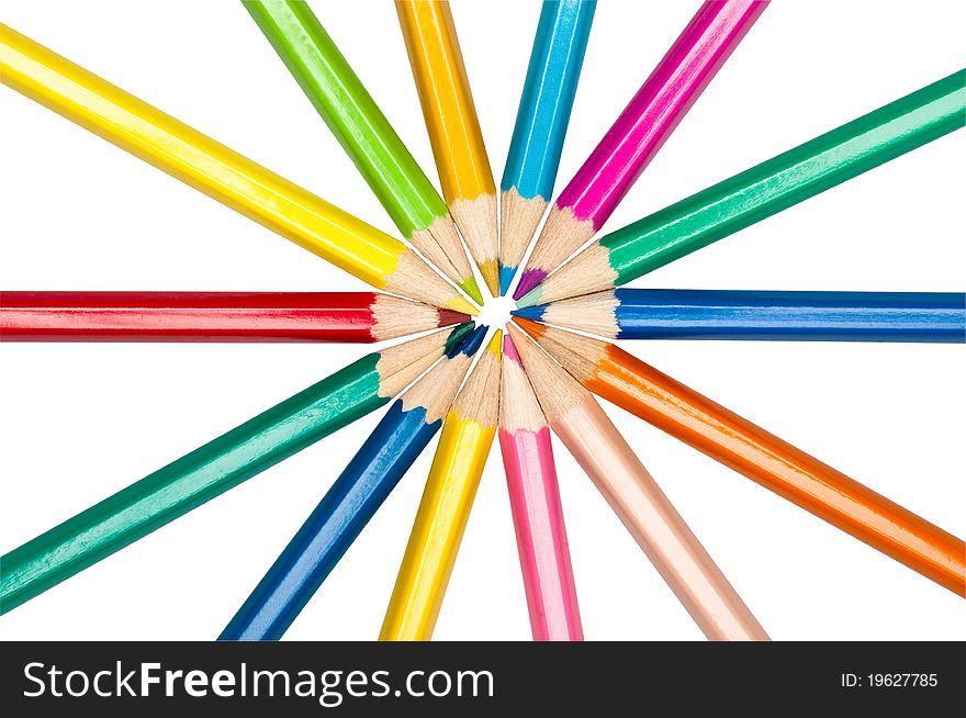 Set of colored pencils arranged in circle isolated