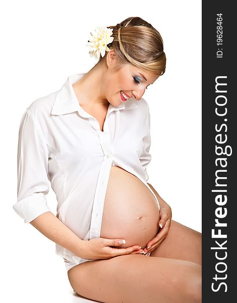 Pregnant woman isolated on white