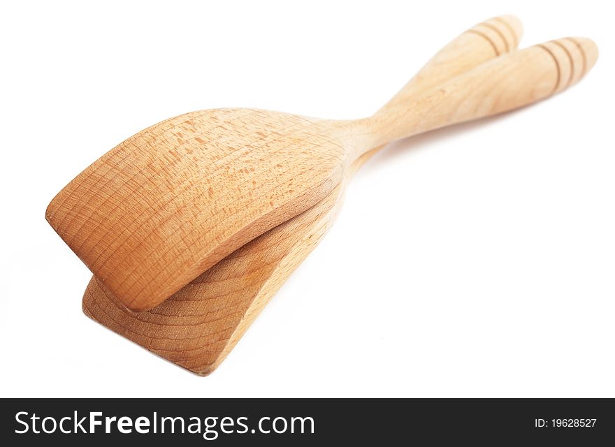 Two wooden spoons on white
