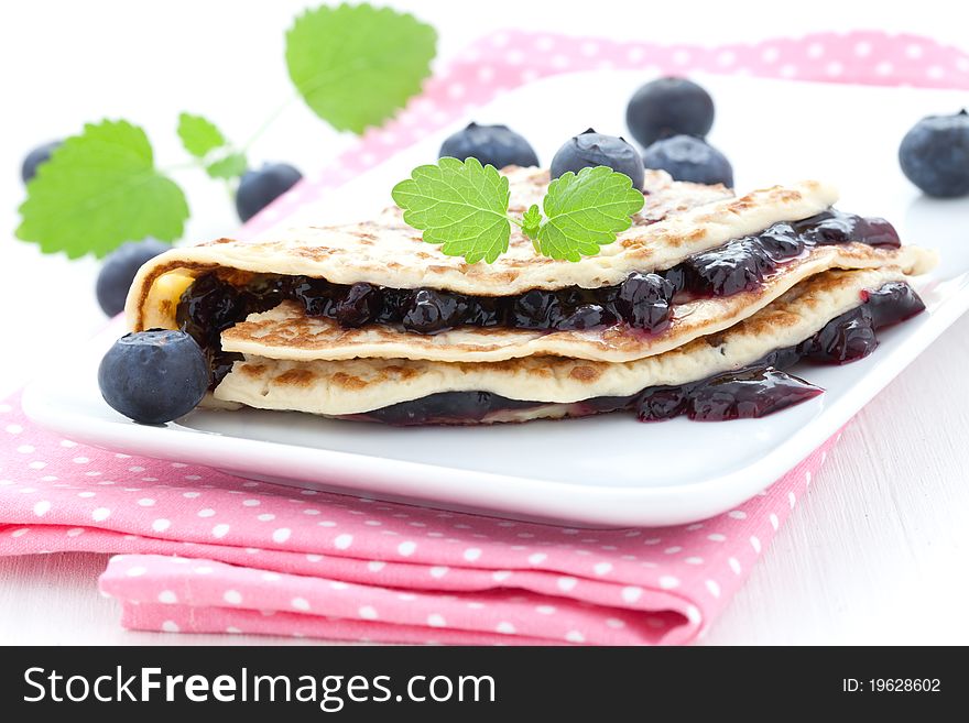 Filled pancake with bilberry jam