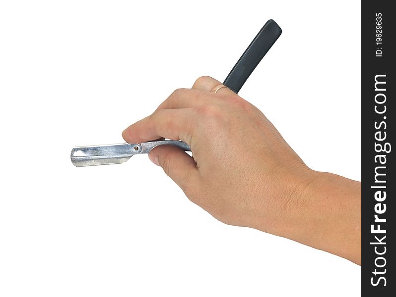 Hand holding classic straight razor on white background