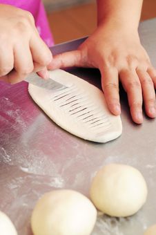Slices The Innder Side Of Dough With Knife Royalty Free Stock Photos Slices The Innder Side Of Dough With Knife Royalty Free Stock Photos