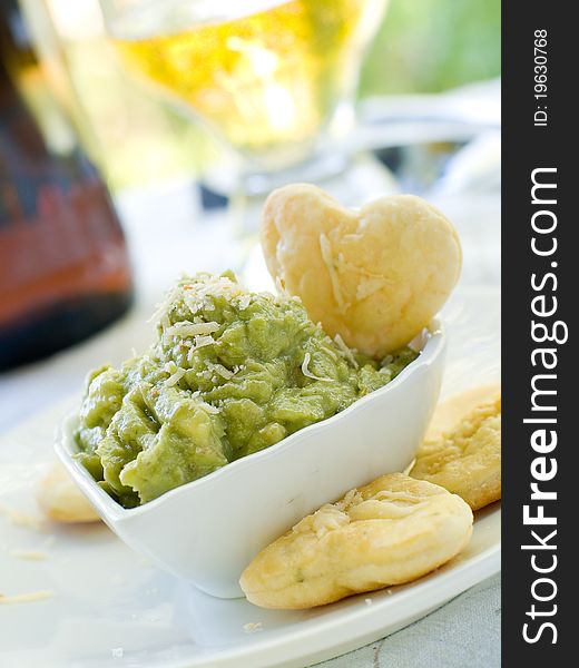Bowl of fresh guacamole with cookies. Selective focus. Bowl of fresh guacamole with cookies. Selective focus