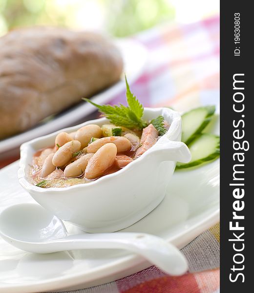 Bowl of vegetable soup with beans. Selective focus