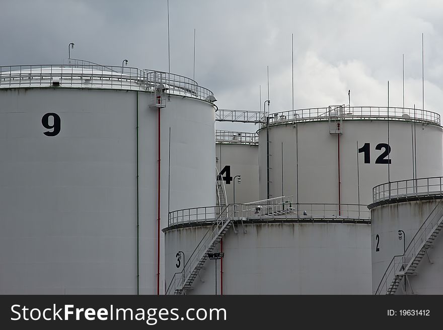 Tanks in oil refinery factory on the cloudy sky. Tanks in oil refinery factory on the cloudy sky