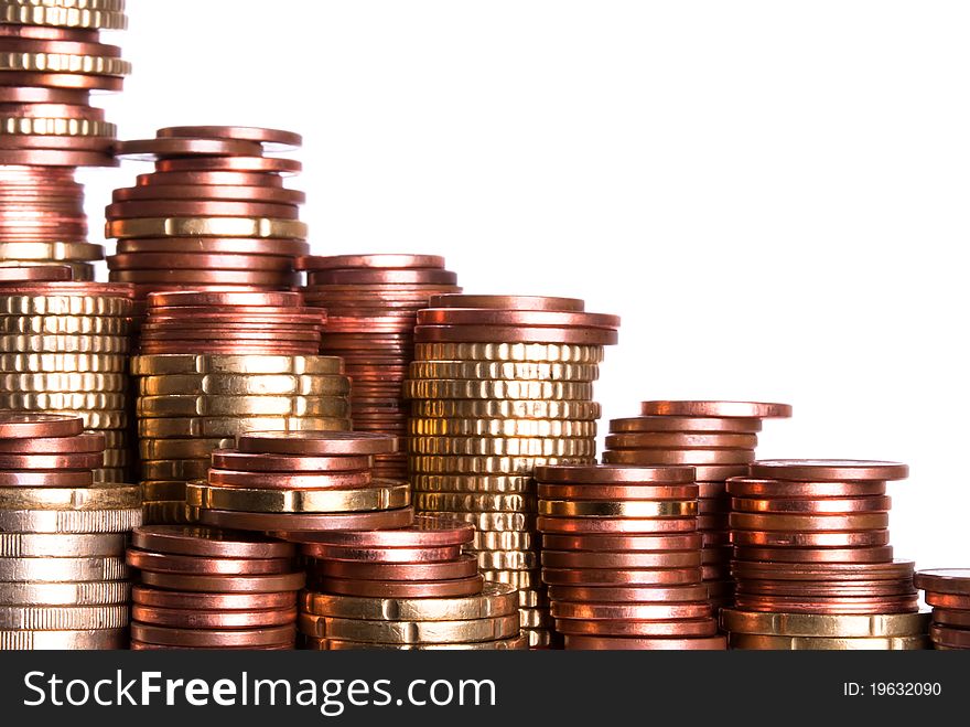 Many coin piles of eurocoins stand side by side