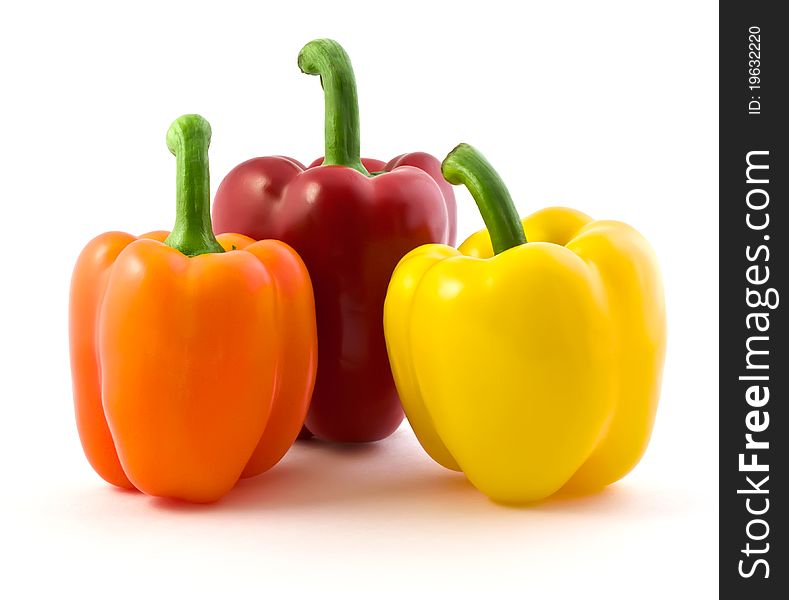 Three color peppers isolated on white background