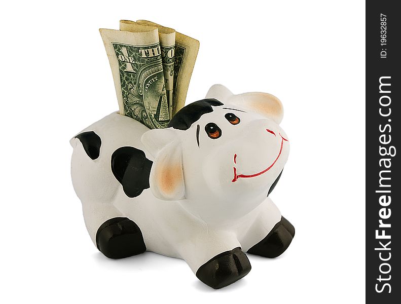 Piggy bank with money in the form of a funny cow
