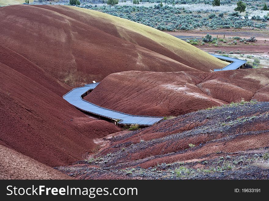 A boardwalk leads through a section of painted hills in Oregon. A boardwalk leads through a section of painted hills in Oregon.