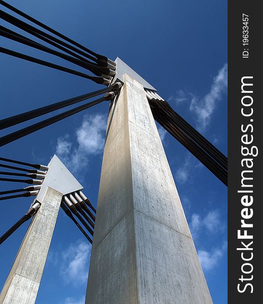 Closeup of bridge construction over blue sky